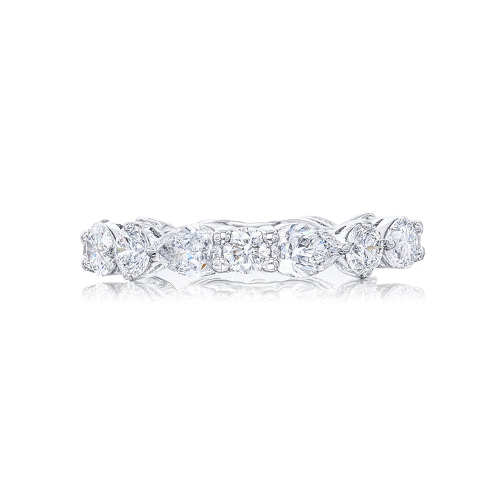 Stunning diamond eternity band featuring 8 round and 8 pear shaped-cut diamonds in a shared prong setting. Handcrafted in pure platinum.