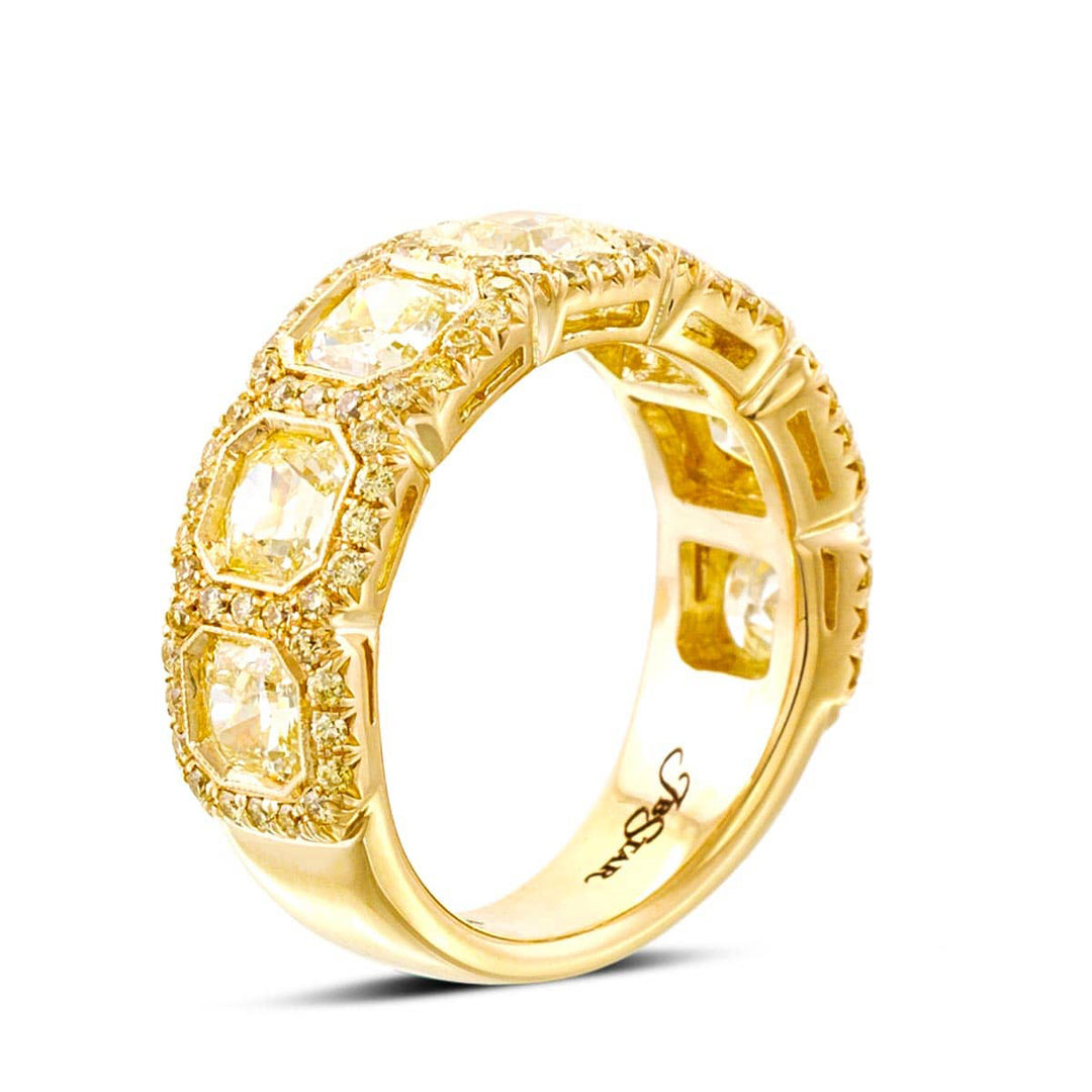 Elegance Elevated: Our classic 2.73 ctw. Bezel Pave Diamond Band. These seven beautiful radiant-cut fancy yellow diamonds embraced by fancy yellow pave diamonds are handcrafted in 18KY gold.