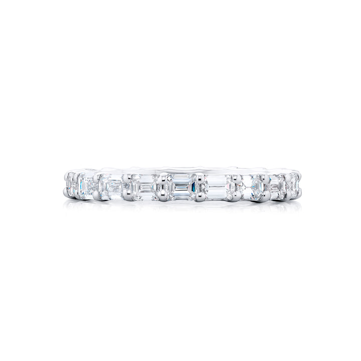 Alluring Eternity: Our stunning single row 1.90 ctw. East-West Diamond Eternity Band. These twenty dazzling emerald-cut diamonds are handcrafted in pure platinum.