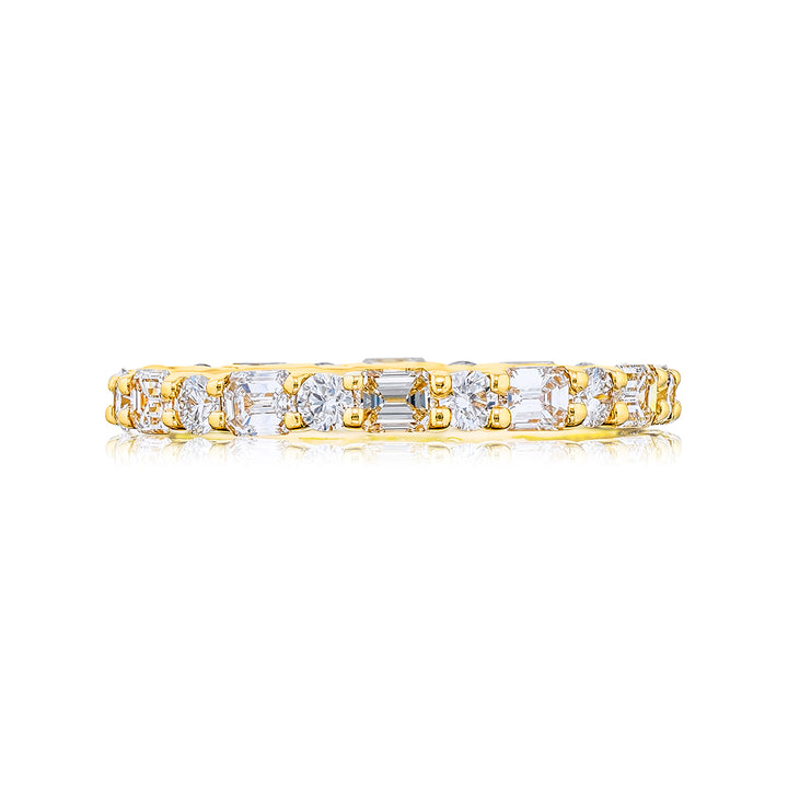 Alluring Eternity: Our stunning East-West Diamond Eternity Band. These stunning emerald-cut and round diamonds are handcrafted in 18KY gold.