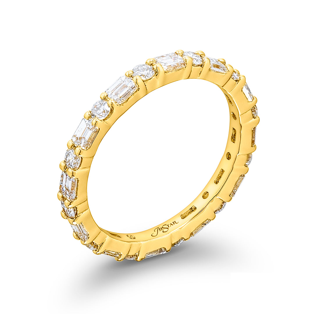Alluring Eternity: Our stunning East-West Diamond Eternity Band. These stunning emerald-cut and round diamonds are handcrafted in 18KY gold.
