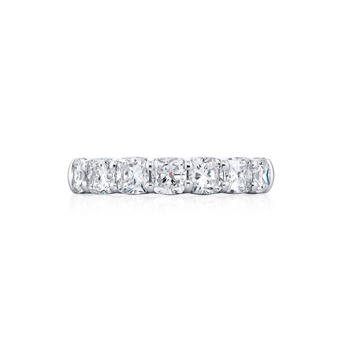 Elegance Elevated: Our stunning single row 1.87 ctw. Diamond Band. These seven beautiful cushion-cut diamonds are handcrafted in pure platinum.