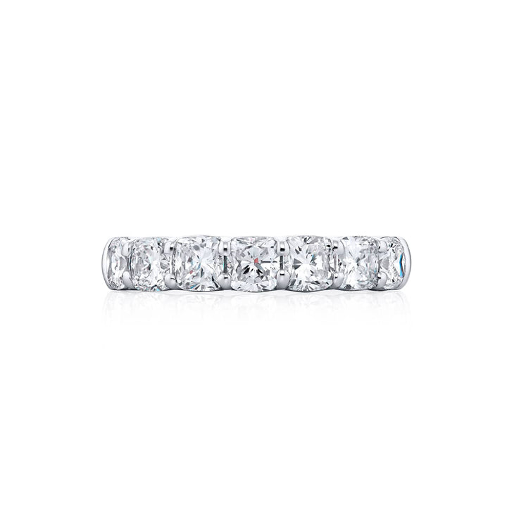 Elegance Elevated: Our stunning single row 1.87 ctw. Diamond Band. These seven beautiful cushion-cut diamonds are handcrafted in pure platinum.
