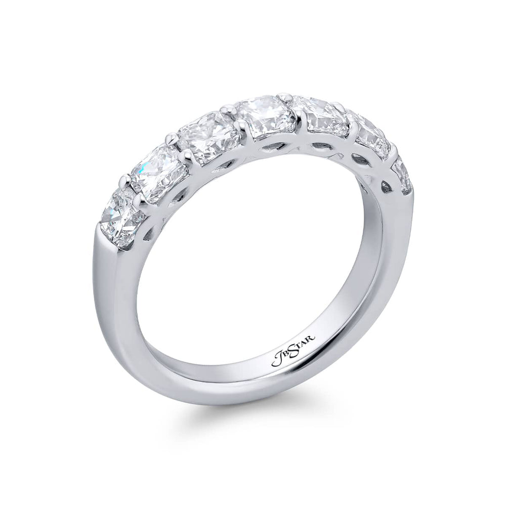 Elegance Elevated: Our stunning single row 1.87 ctw. Diamond Band. These seven beautiful cushion-cut diamonds are handcrafted in pure platinum.