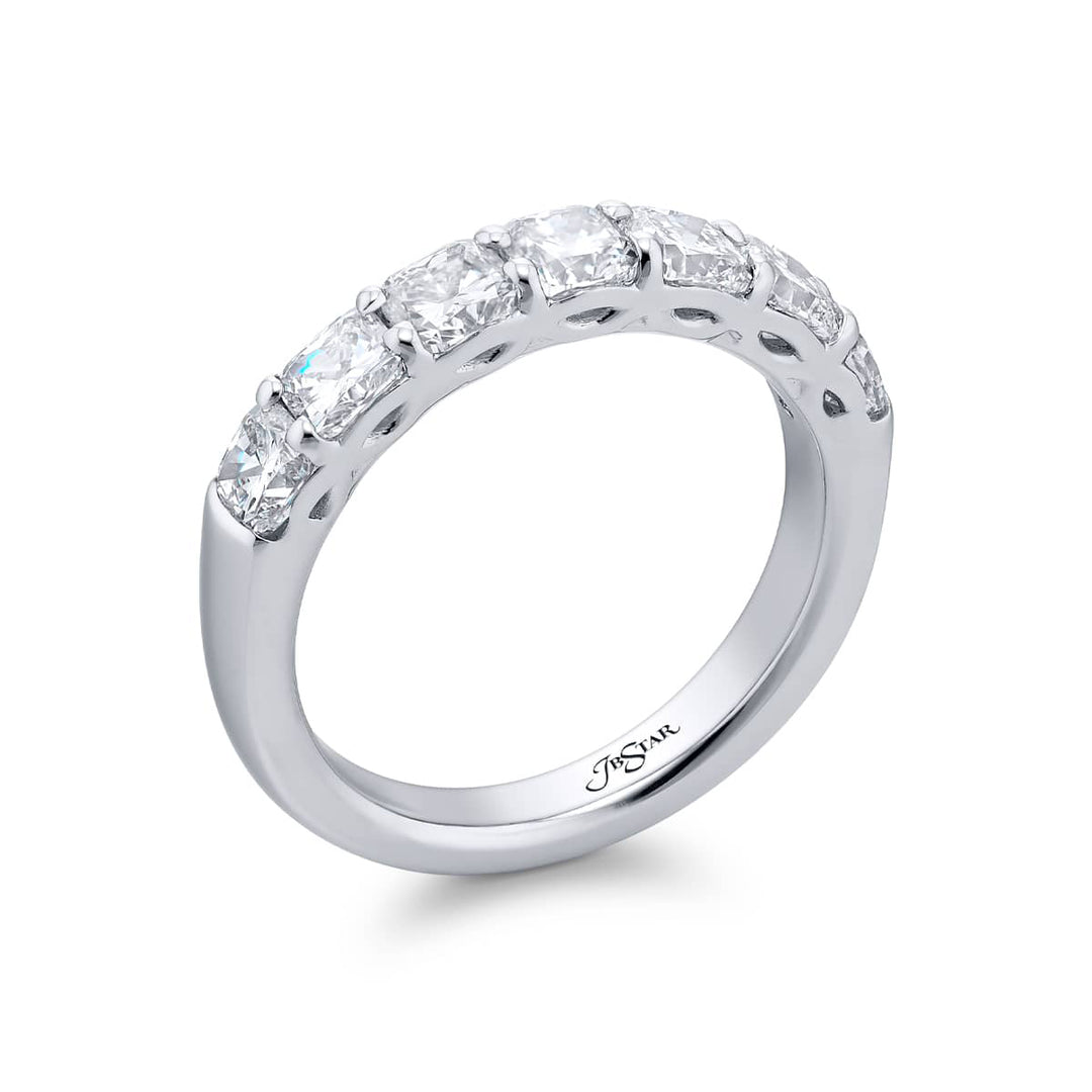 Elegance Elevated: Our stunning single row 1.87 ctw. Diamond Band. These seven beautiful cushion-cut diamonds are handcrafted in pure platinum.