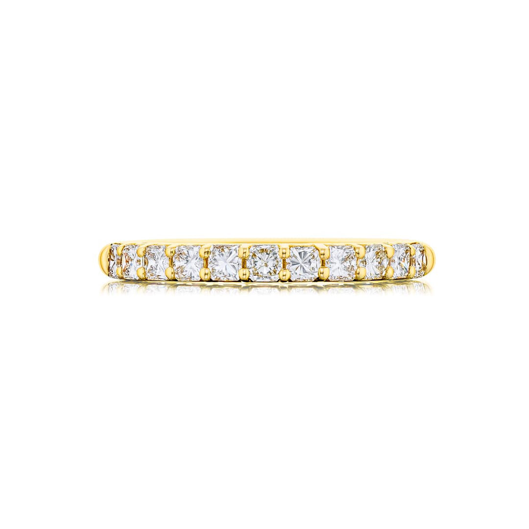 Elegance Elevated: Our classic 0.70 ctw. Diamond Band. These eleven stunning radiant-cut diamonds are handcrafted in 18KY gold.