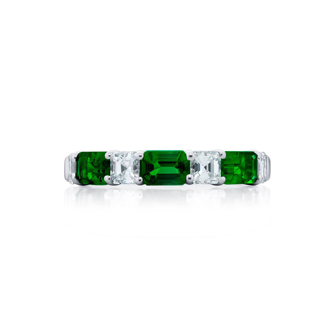 Elegance Elevated: Our classic East-West Emerald and Diamond Band. These beautiful emerald-cut emeralds blended with square emerald-cut diamonds are handcrafted in pure platinum.