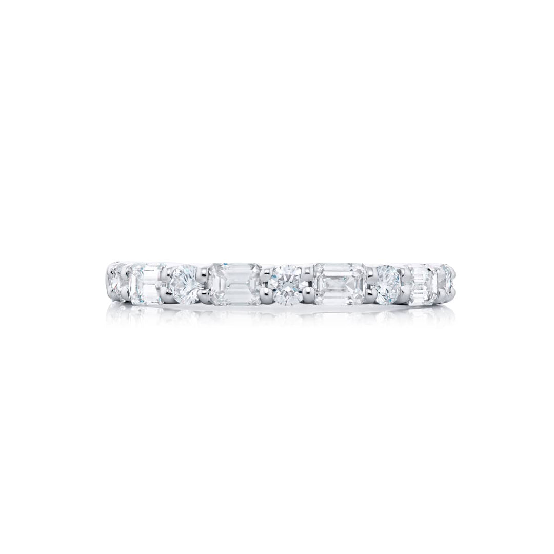 Elegance Elevated: Our classic single-row 1.80 ctw. East-West Diamond Band. These beautiful round diamonds blended with emerald-cut diamonds are handcrafted in pure platinum.