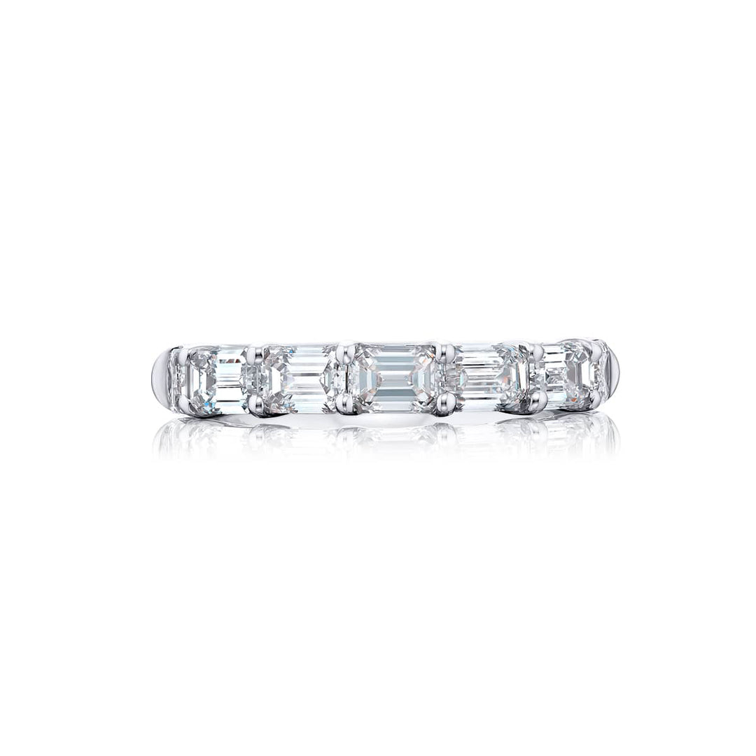 Elegance Elevated: Our classic single row East-West Diamond Band. These seven beautiful emerald-cut diamonds are handcrafted in pure platinum.