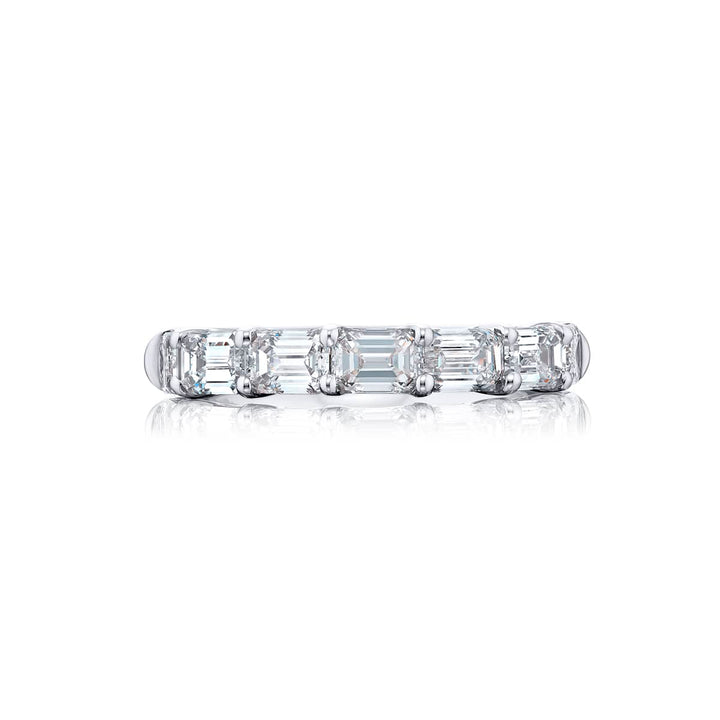 Elegance Elevated: Our classic single row East-West Diamond Band. These seven beautiful emerald-cut diamonds are handcrafted in pure platinum.