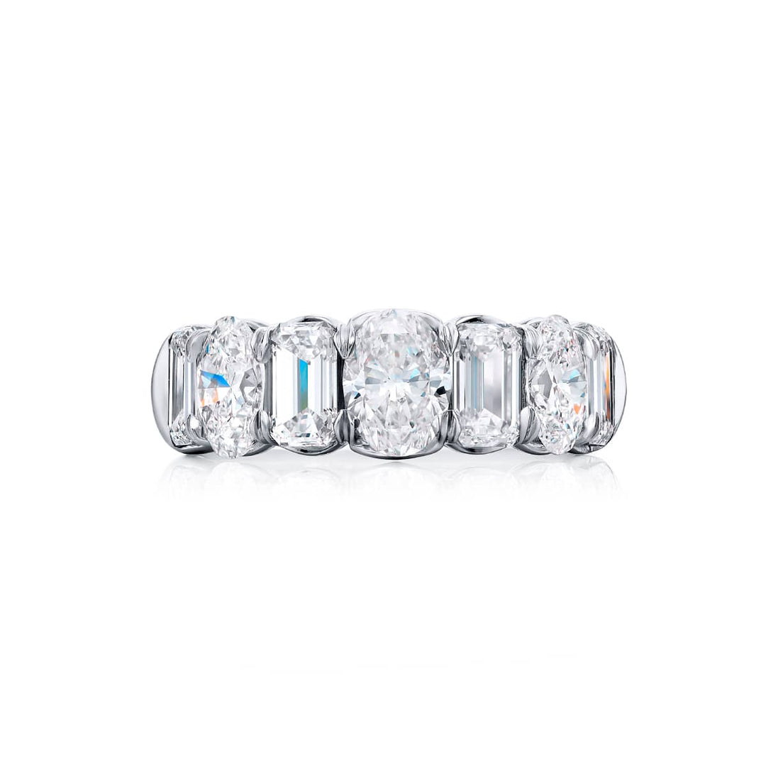 Elegance Elevated: Our signature 4.10 ctw. Diamond Band. These beautiful emerald-cut diamonds blended with oval diamonds are handcrafted in pure platinum.