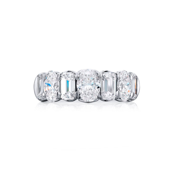 Elegance Elevated: Our signature 4.10 ctw. Diamond Band. These beautiful emerald-cut diamonds blended with oval diamonds are handcrafted in pure platinum.