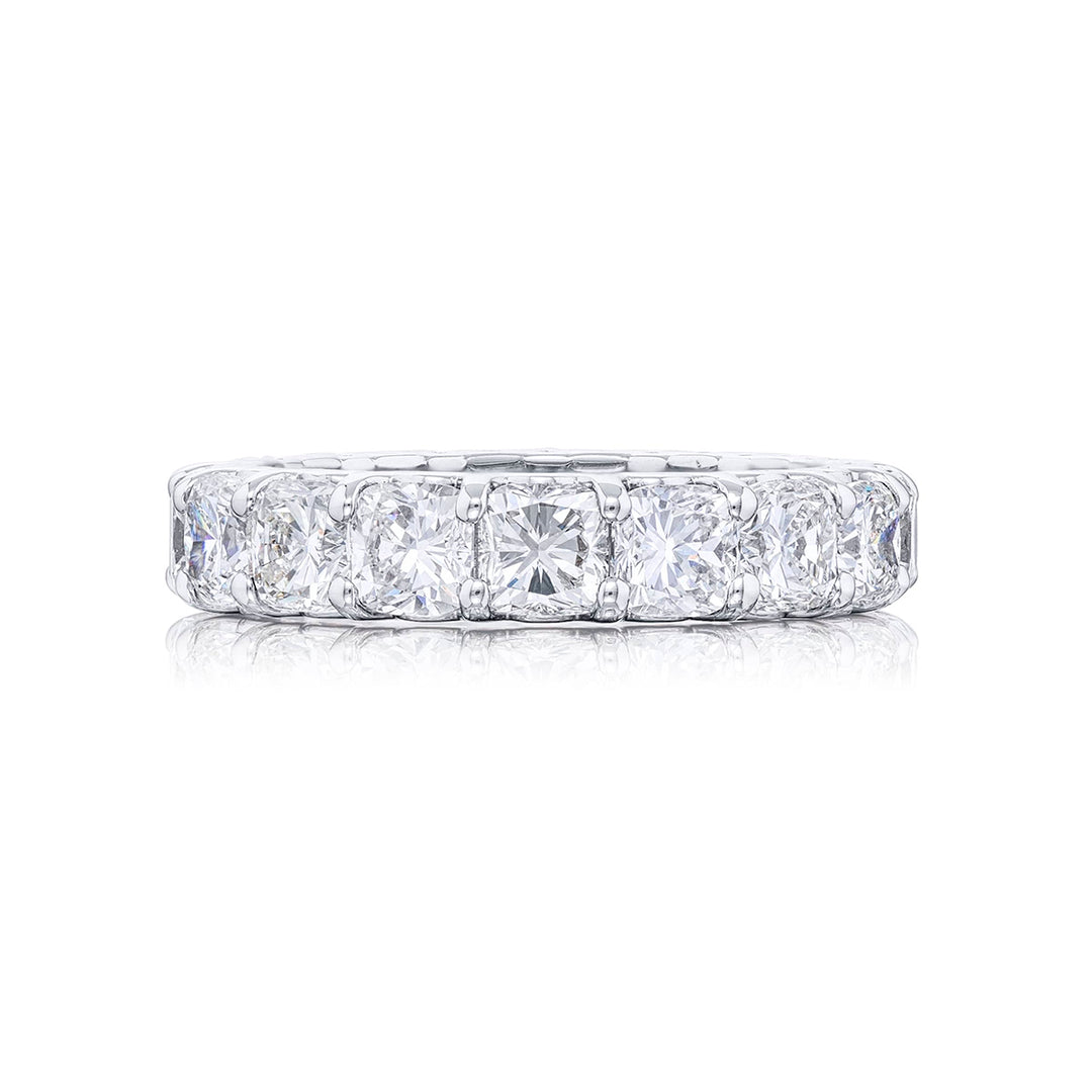 Stunning diamond eternity band featuring 17 perfectly matched cushion-cut diamonds in a shared prong setting. Handcrafted in pure platinum.