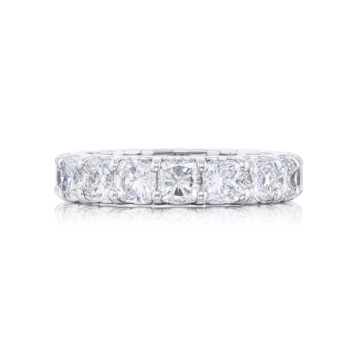 Stunning diamond eternity band featuring 17 perfectly matched cushion-cut diamonds in a shared prong setting. Handcrafted in pure platinum.
