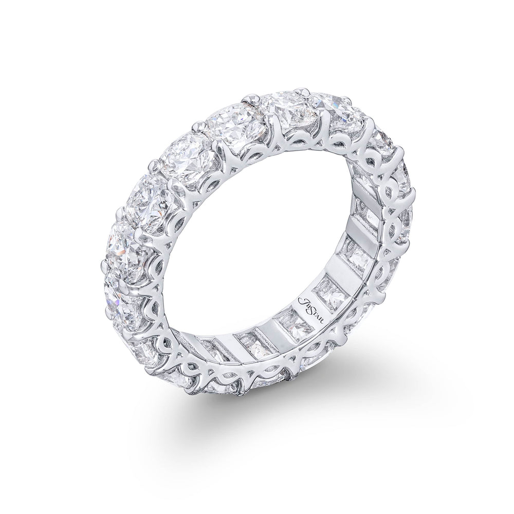 Stunning diamond eternity band featuring 17 perfectly matched cushion-cut diamonds in a shared prong setting. Handcrafted in pure platinum.