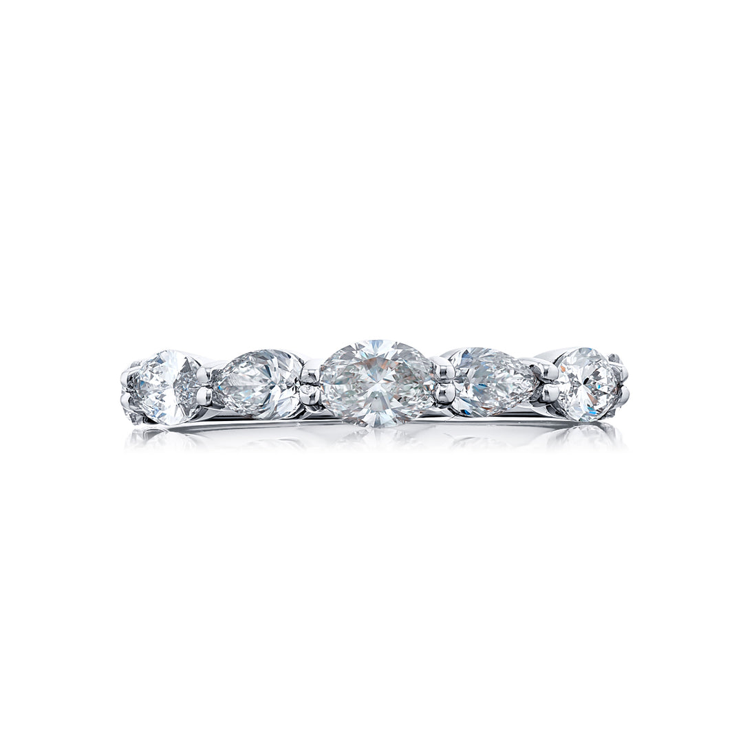 Elegance Elevated: Our timeless single-row East-West Diamond Band. This beautiful oval diamond blends with square emerald-cut and marquise diamonds and are handcrafted in pure platinum.
