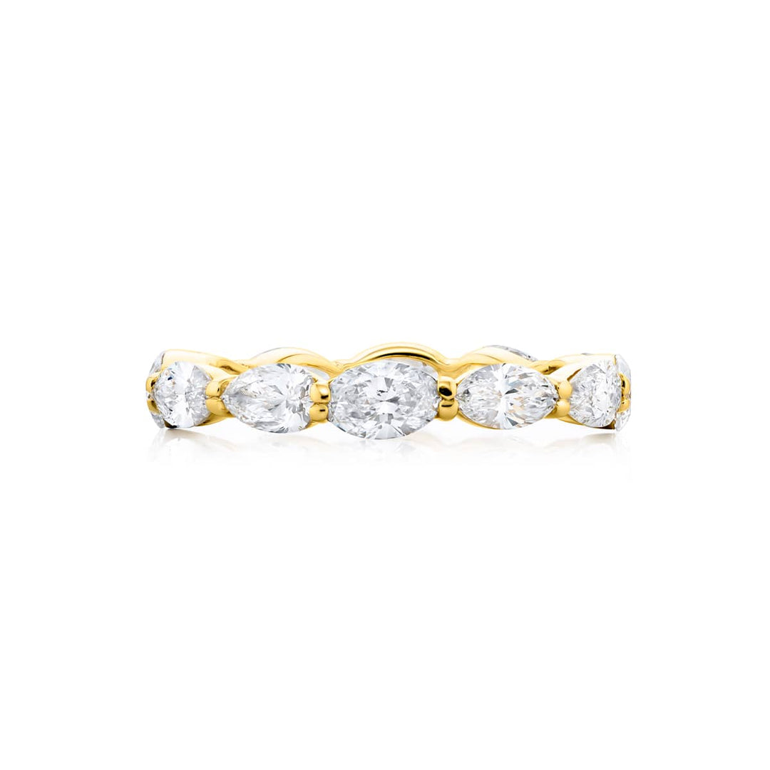 Alluring Eternity: Our stunning 2.40 ctw. East-West Diamond Eternity Band. These beautiful marquise oval and pear-shaped diamonds are handcrafted in 14K yellow gold.