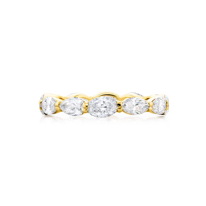 Alluring Eternity: Our stunning 2.40 ctw. East-West Diamond Eternity Band. These beautiful marquise oval and pear-shaped diamonds are handcrafted in 14K yellow gold.