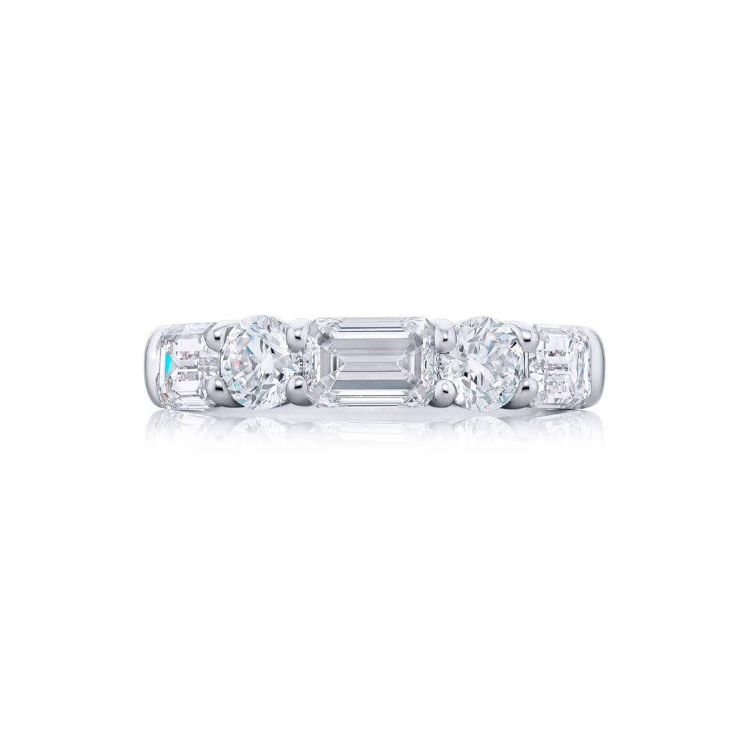 Elegance Elevated: Our classic 3.03 ctw. East-West single row Diamond Band. These beautiful emerald-cut diamonds accompany round diamonds and are handcrafted in pure platinum