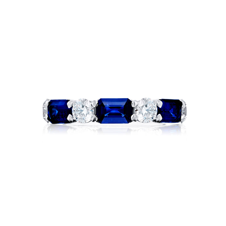 Elegance Elevated: Our signature East-West Sapphire and Diamond Band. These beautiful emerald-cut sapphires blend with round diamonds and are handcrafted in pure platinum.