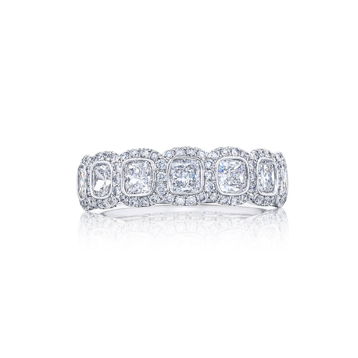 Elegance Elevated: Our signature Bezel Diamond Band. These seven gorgeous cushion-cut diamonds embraced by micro pave diamonds are handcrafted in pure platinum.