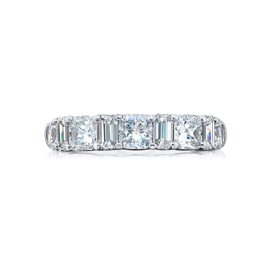 Elegance Elevated: Our stunning 3.38 ctw. Diamond Band. These stunning cushion-cut diamonds flanked by dazzling emerald-cut diamonds are handcrafted in pure platinum.