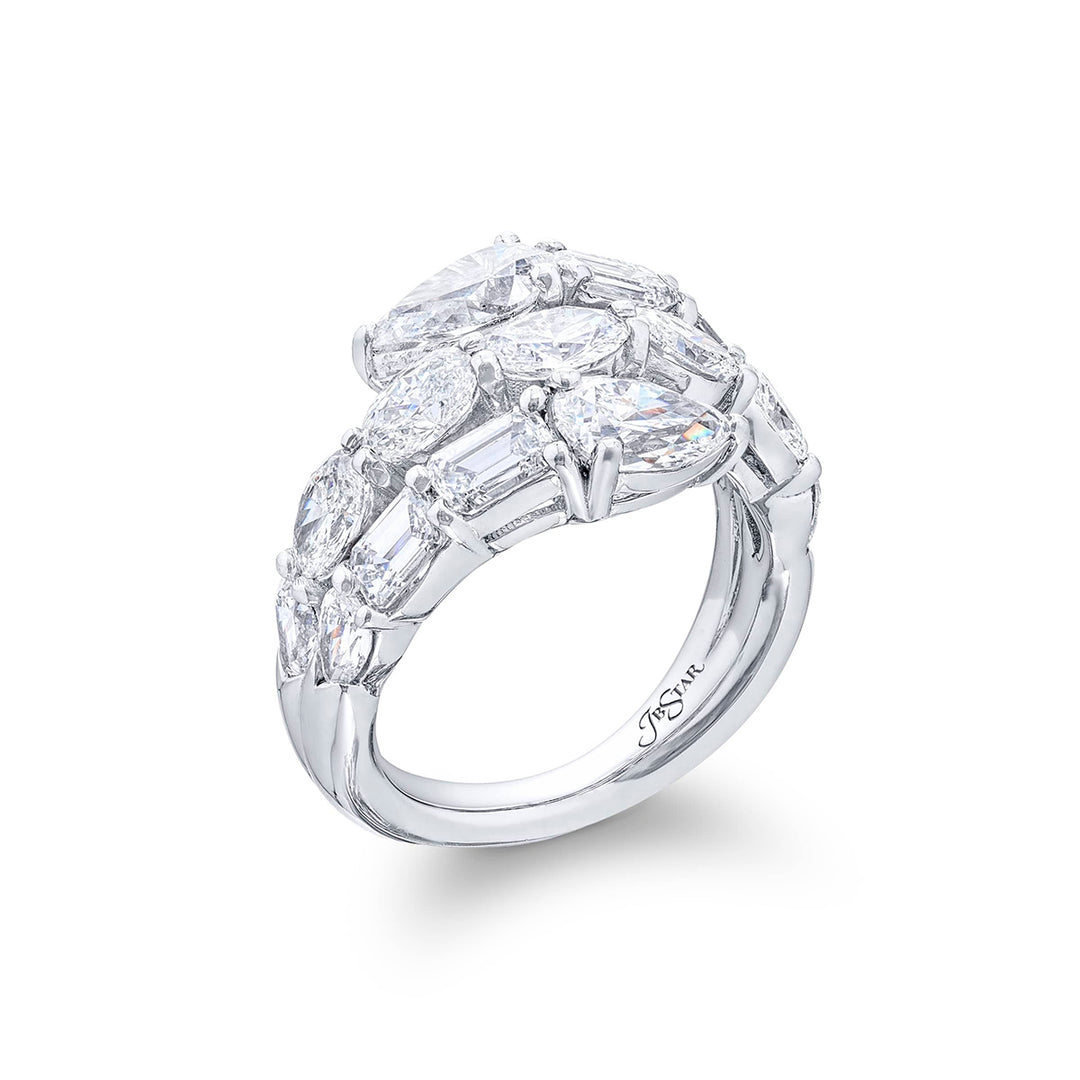 Dazzling three row diamond ring featuring pear shaped emeraldand and oval diamonds in a stunning design. Handcrafted in pure platinum.