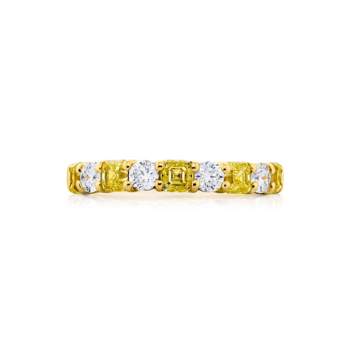 Elegance Elevated: Our signature 1.14 ctw. East-West Diamond Band. These beautiful square emerald-cut fancy yellow diamonds blended with round diamonds are handcrafted in 18K yellow gold.