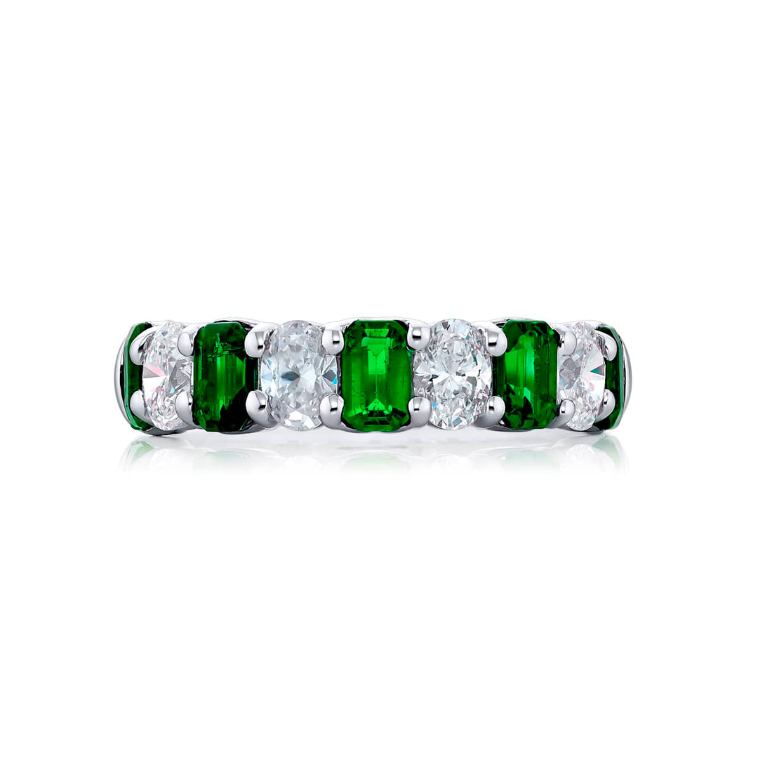 Elegance Elevated: Our classic single row Emerald Band. These beautiful emerald-cut emeralds blended with oval diamonds are handcrafted in pure platinum.
