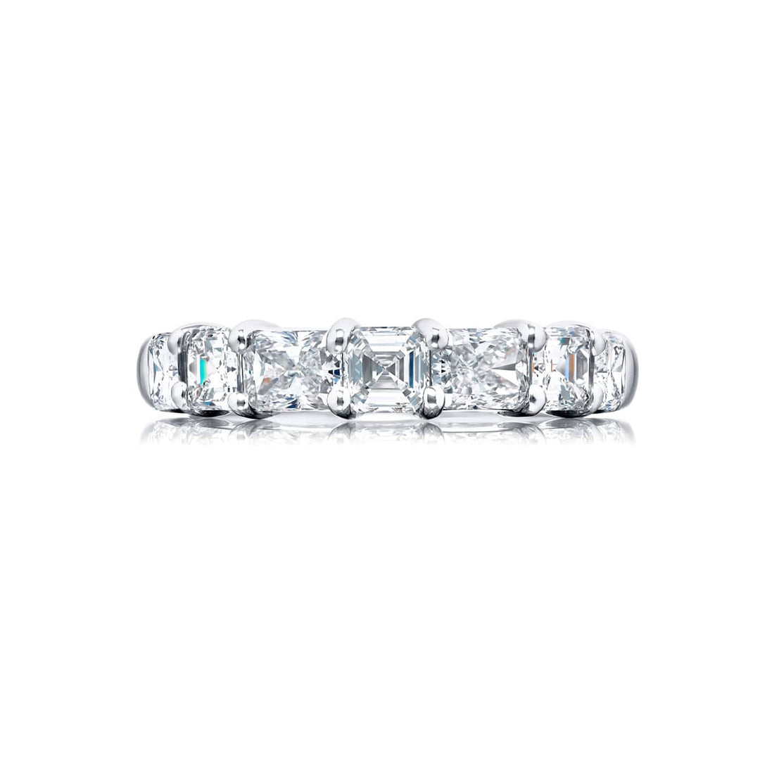 Elegance Elevated: Our classic single row Diamond Band. These stunning square emerald-cut and radiant diamonds are handcrafted in pure platinum.