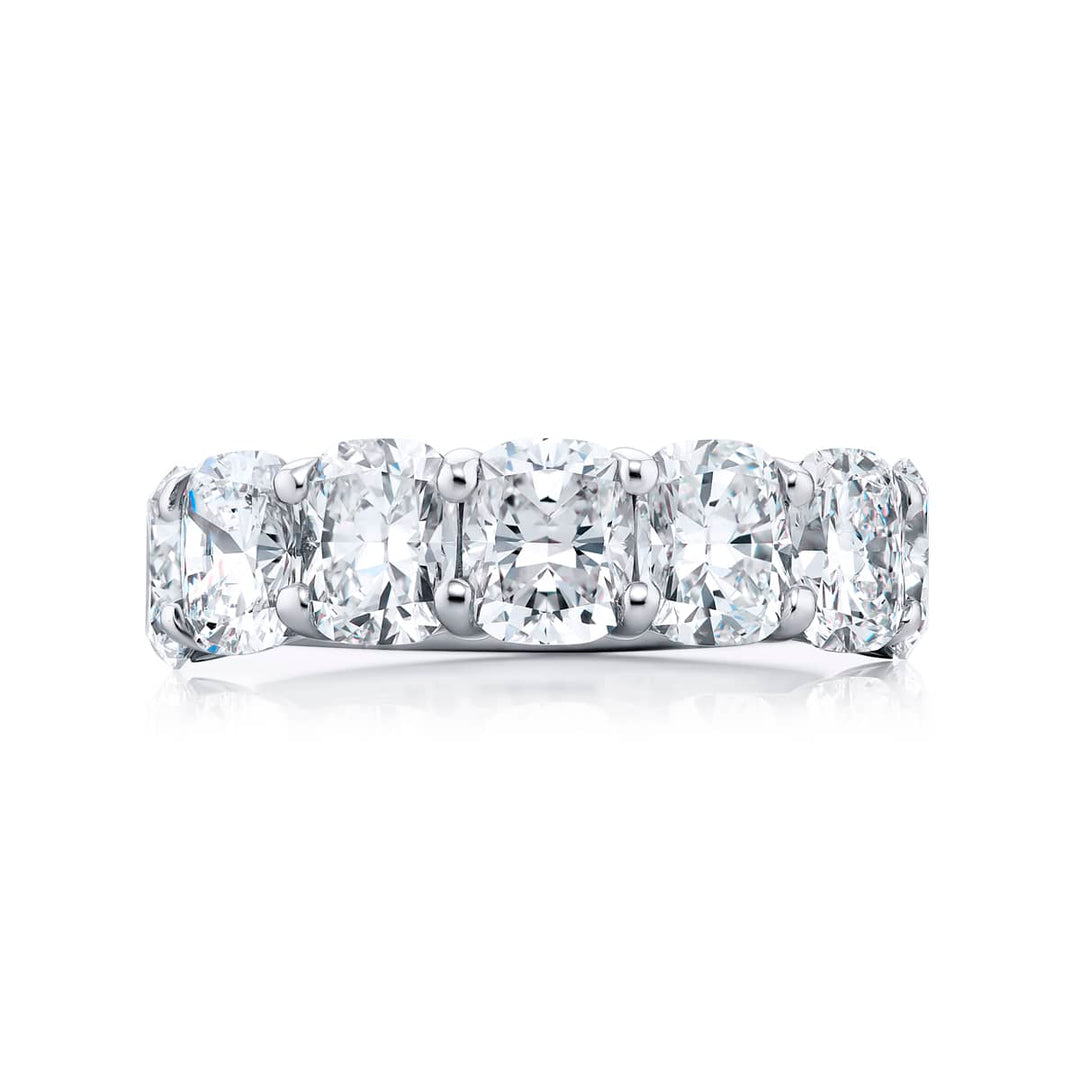 Elegance Elevated: Our stunning 4.96 ctw. GIA certified Diamond Band. These seven beautiful cushion-cut diamonds are handcrafted in pure platinum.