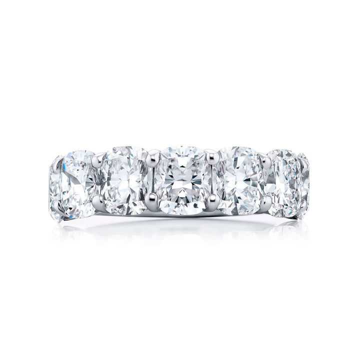 Elegance Elevated: Our stunning 4.96 ctw. GIA certified Diamond Band. These seven beautiful cushion-cut diamonds are handcrafted in pure platinum.