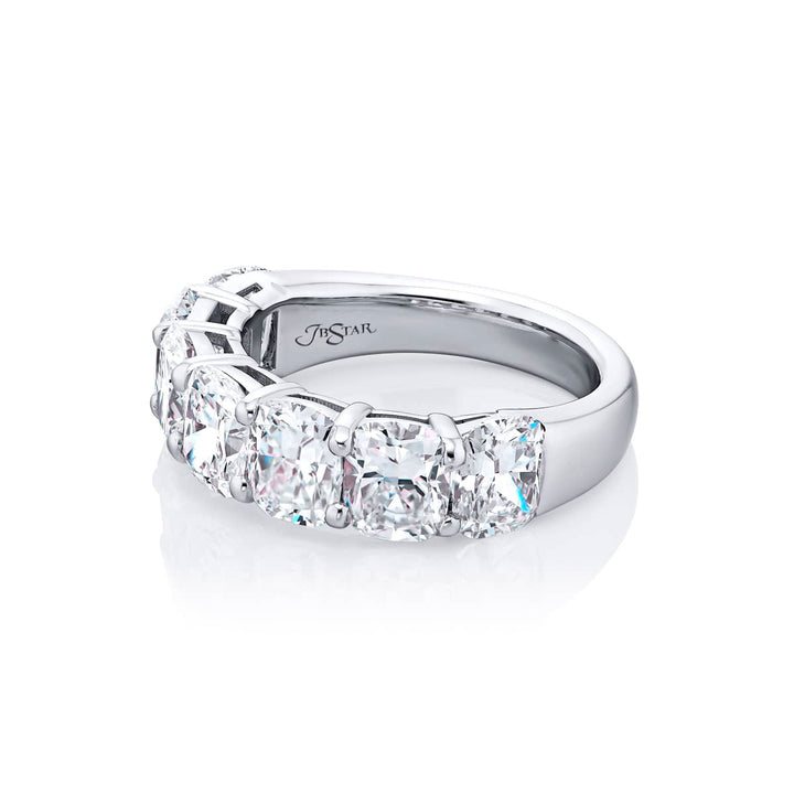 Elegance Elevated: Our stunning 4.96 ctw. GIA certified Diamond Band. These seven beautiful cushion-cut diamonds are handcrafted in pure platinum.