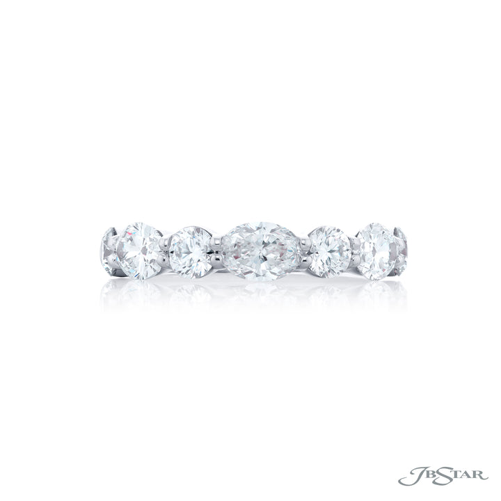 Elegance Elevated: Our classic 1.88 ctw. East-West Diamond Band. These beautiful oval diamonds blended with round diamonds are handcrafted in pure platinum.