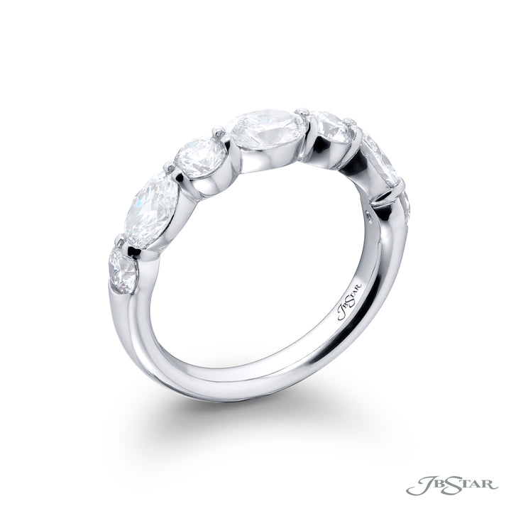 Elegance Elevated: Our classic 1.88 ctw. East-West Diamond Band. These beautiful oval diamonds blended with round diamonds are handcrafted in pure platinum.