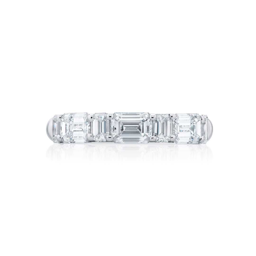 Elegance Elevated: Our stunning 2.10 ctw. East-West Diamond Band. These seven beautiful emerald-cut diamonds are handcrafted in pure platinum.