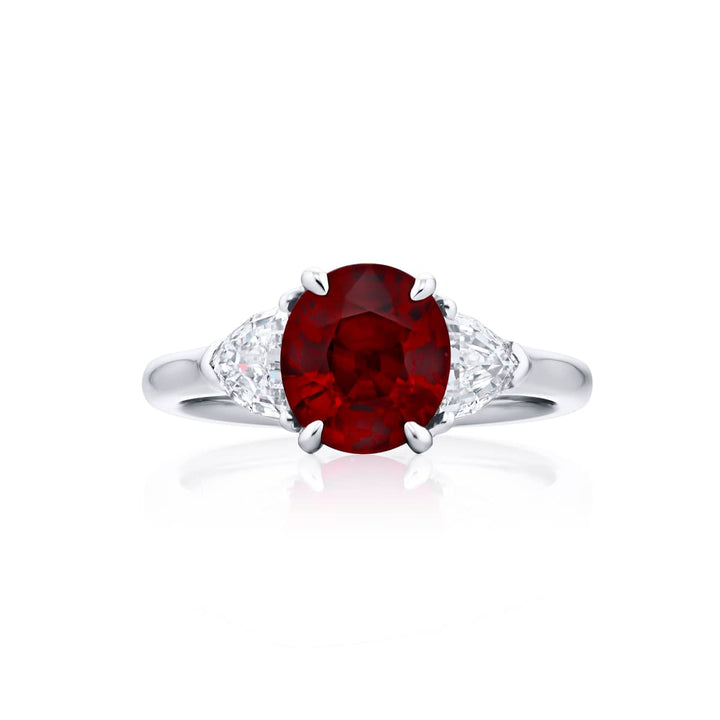 Breathtaking Radiance: Our beautiful 2.08 ct. certified Pigeon?s Blood Ruby Ring. This stunning oval ruby flanked by dazzling epaulette diamonds is handcrafted in pure platinum.